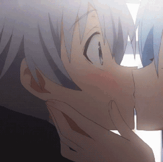 a close up of two anime characters kissing each other