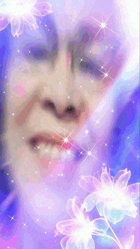 a close up of a woman 's face with flowers in the background