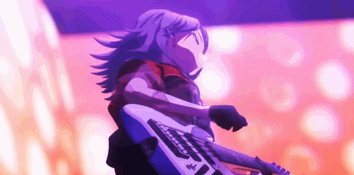 a girl is playing a guitar on a stage in front of a crowd .