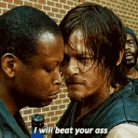 two men are standing next to each other and one of them is saying " i will beat your ass " .