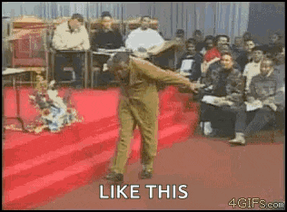 a man is dancing on a stage in front of a crowd with the words like this .
