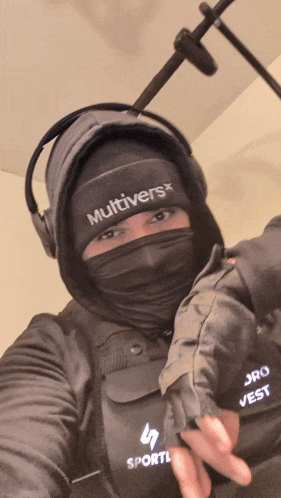 a person wearing a mask with the word multivers on the front