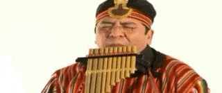 a man wearing a striped shirt and a headband is playing a musical instrument .