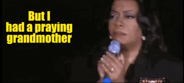 a woman singing into a microphone with the words but i had a praying grandmother