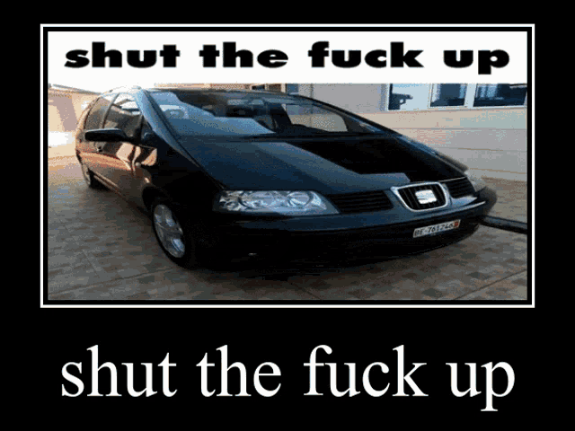 a picture of a black car with the words shut the fuck up