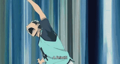 a man in a blue shirt is jumping in the air while shouting .