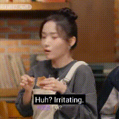 a woman is eating a sandwich with a sign that says `` huh ? irritating . ''