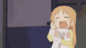 a cartoon girl is crying while holding a stuffed animal in her arms .