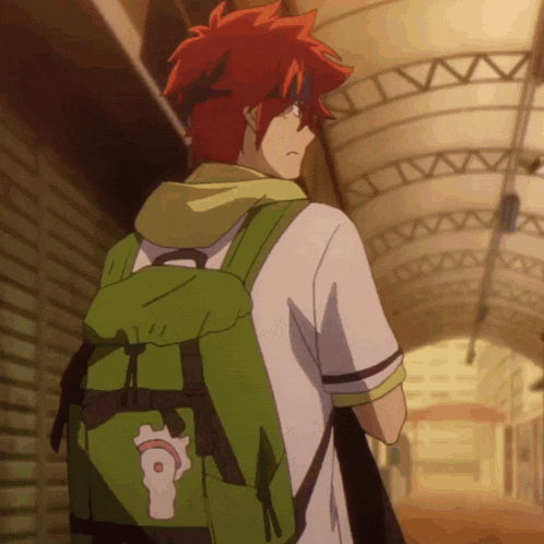 a man with red hair and a green backpack