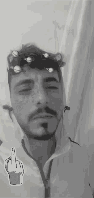 a man with planets on his head and a middle finger
