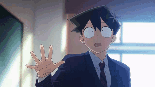 a cartoon character in a suit and tie making a funny face