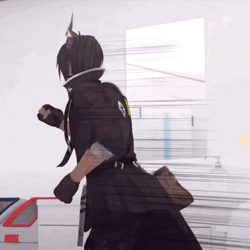 a person in a black outfit with the letter t on their back