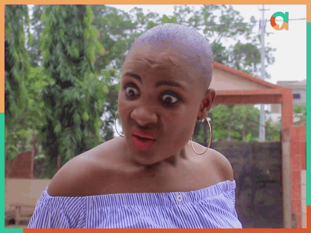 a woman with a shaved head makes a surprised face