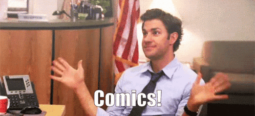 a man in a blue shirt and tie is sitting at a desk with his hands outstretched and the words `` comics ! ''