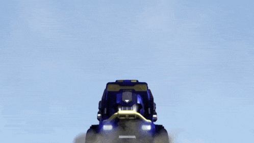 a blue and green vehicle is flying in the air