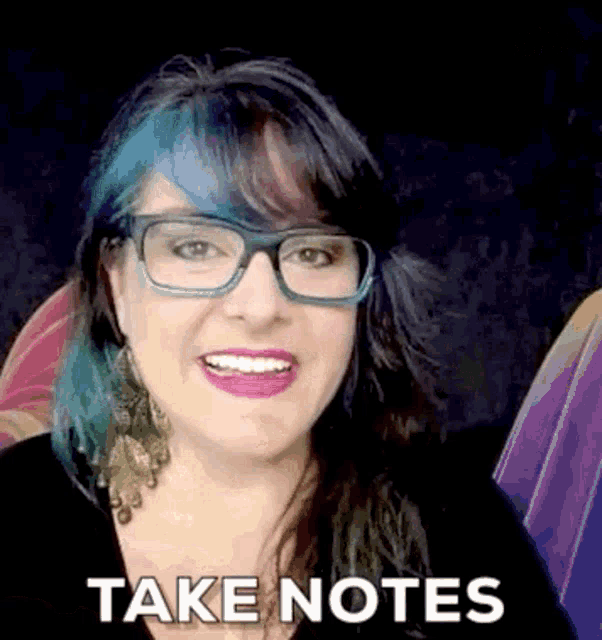 a woman wearing glasses and earrings is smiling and says take notes