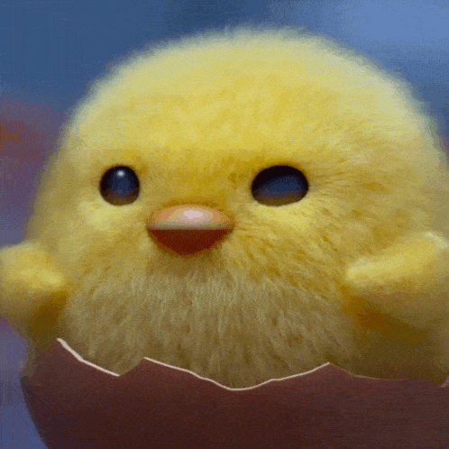a stuffed chicken is coming out of a cracked egg shell