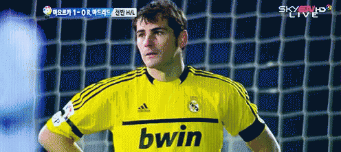 a soccer player wearing a yellow bwin jersey