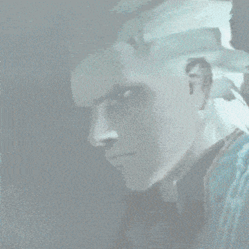 a close up of a person 's face with a serious look on his face