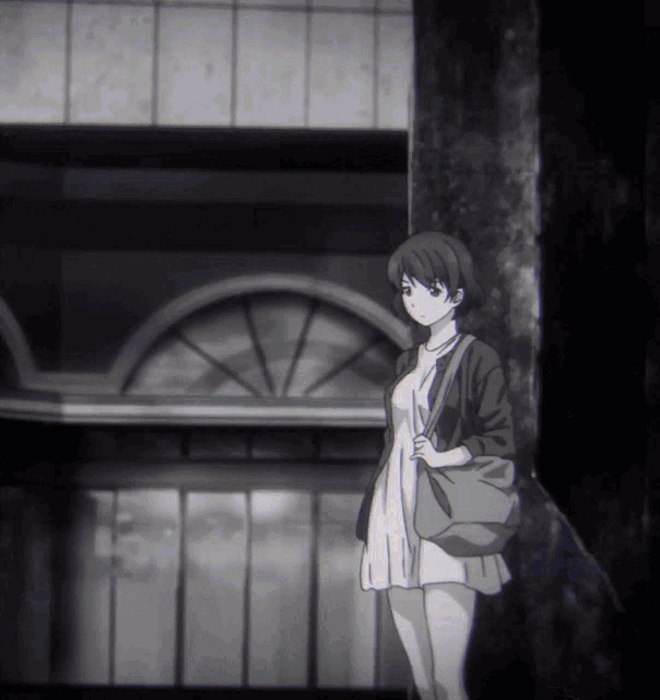 a black and white photo of a girl with a bag on her shoulder