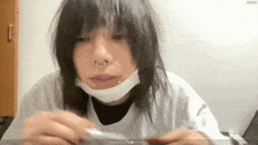 a woman with a nose ring and a mask on her face