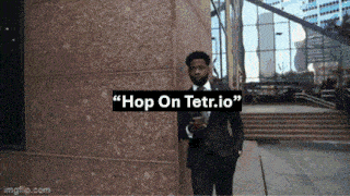 a man in a suit and tie is standing in front of a building with the words " hop on tetr.io " on it