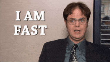 a man in a suit and tie is standing in front of a sign that says i am fast