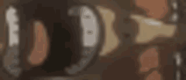 a close up of a door handle on a door with a blurred background .