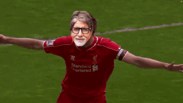 a soccer player with a mask on his face is running on the field