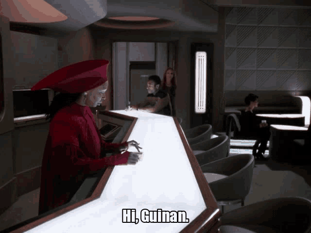 a woman in a red hat is standing at a bar and says hi guinan