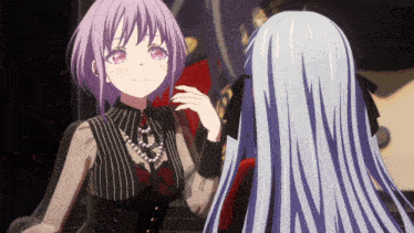a girl with purple hair stands next to another girl with blue hair