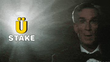 a man in a tuxedo stands in front of a sign that says " stake "