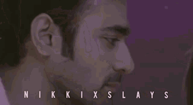a man and a woman are hugging and the words nikki slays are on the purple background