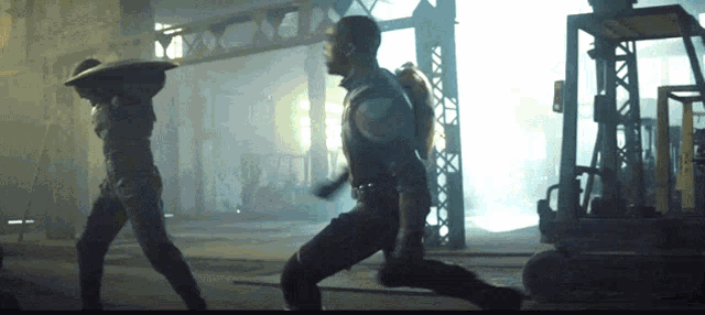 a man in a superhero costume is running in a dark room