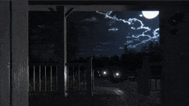 a black and white photo of a ufo flying over a fence