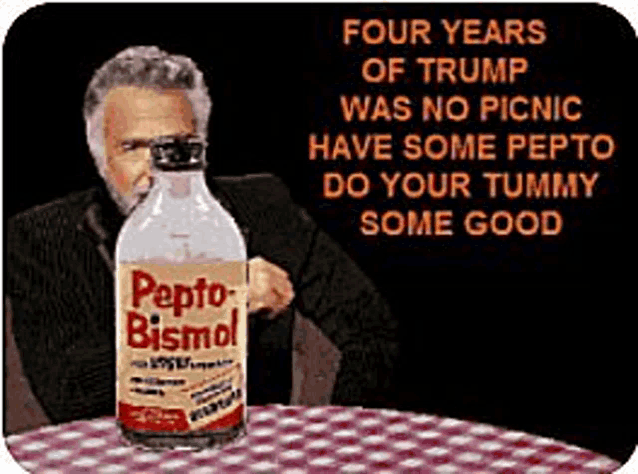 a man sits at a table with a bottle of pepto bismol in front of him