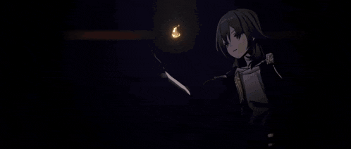 a girl in a black and gold outfit is holding something in her hands .