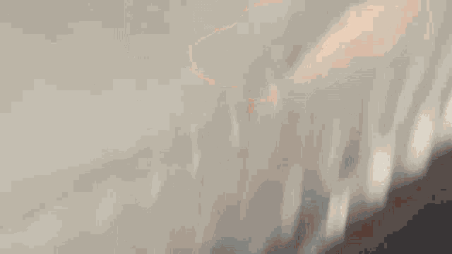 a blurred image of a person 's face with a white circle in the middle