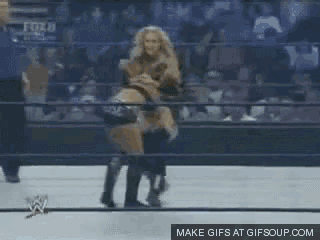 a woman in a wrestling ring with the words make gifs at gifsoup.com in the corner