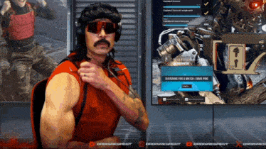 a man wearing sunglasses and a red shirt is playing a video game