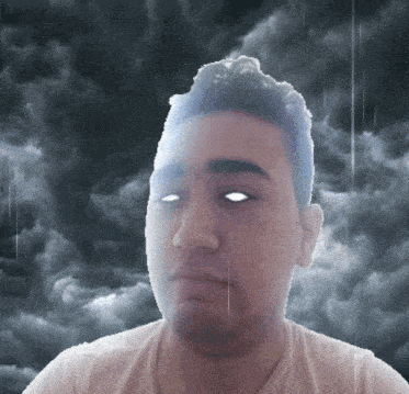 a man 's face is shown in front of a cloudy sky