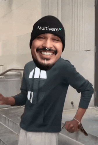 a man wearing a black beanie that says multivers on it