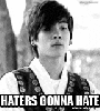 a black and white photo of a young man with the words `` haters gonna hate '' on the bottom .
