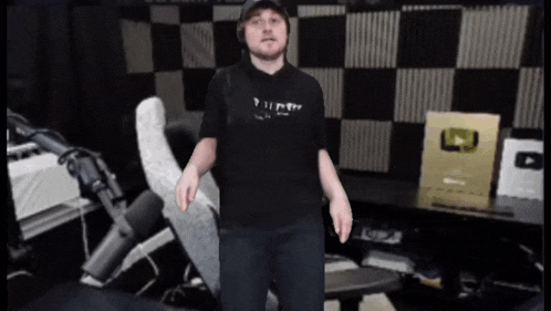 a man wearing a black shirt that says " i 'm a pirate "