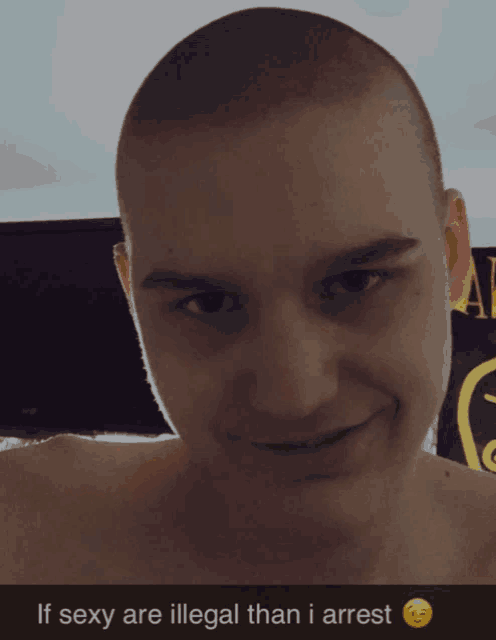 a man with a shaved head is smiling with the words if sexy are illegal than i arrest