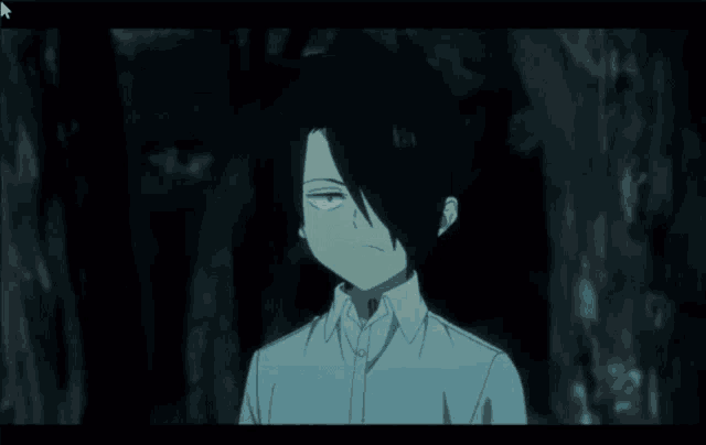a boy in a white shirt holds up his hand