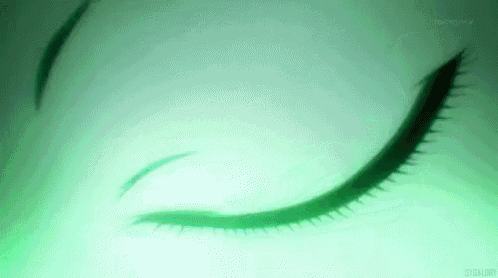 a close up of a person 's eye with a green background