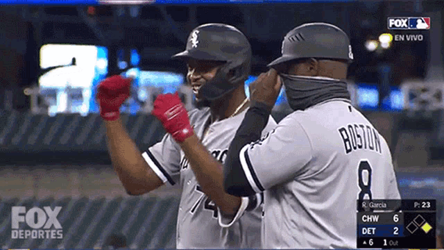 a fox deportes broadcast shows two baseball players celebrating