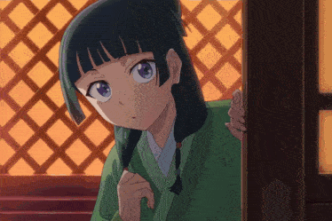 a girl with black hair and blue eyes is peeking out of a door