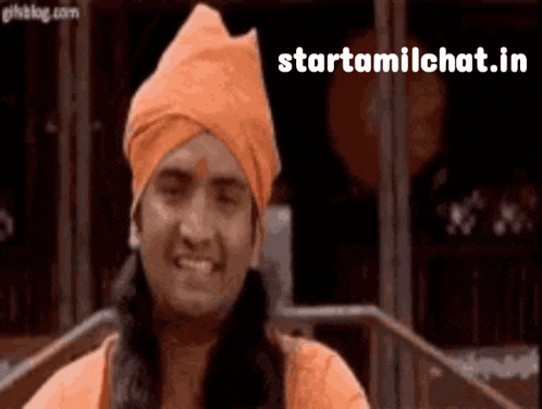 a man wearing an orange turban and smiling with the words starttamilchat.in below him .